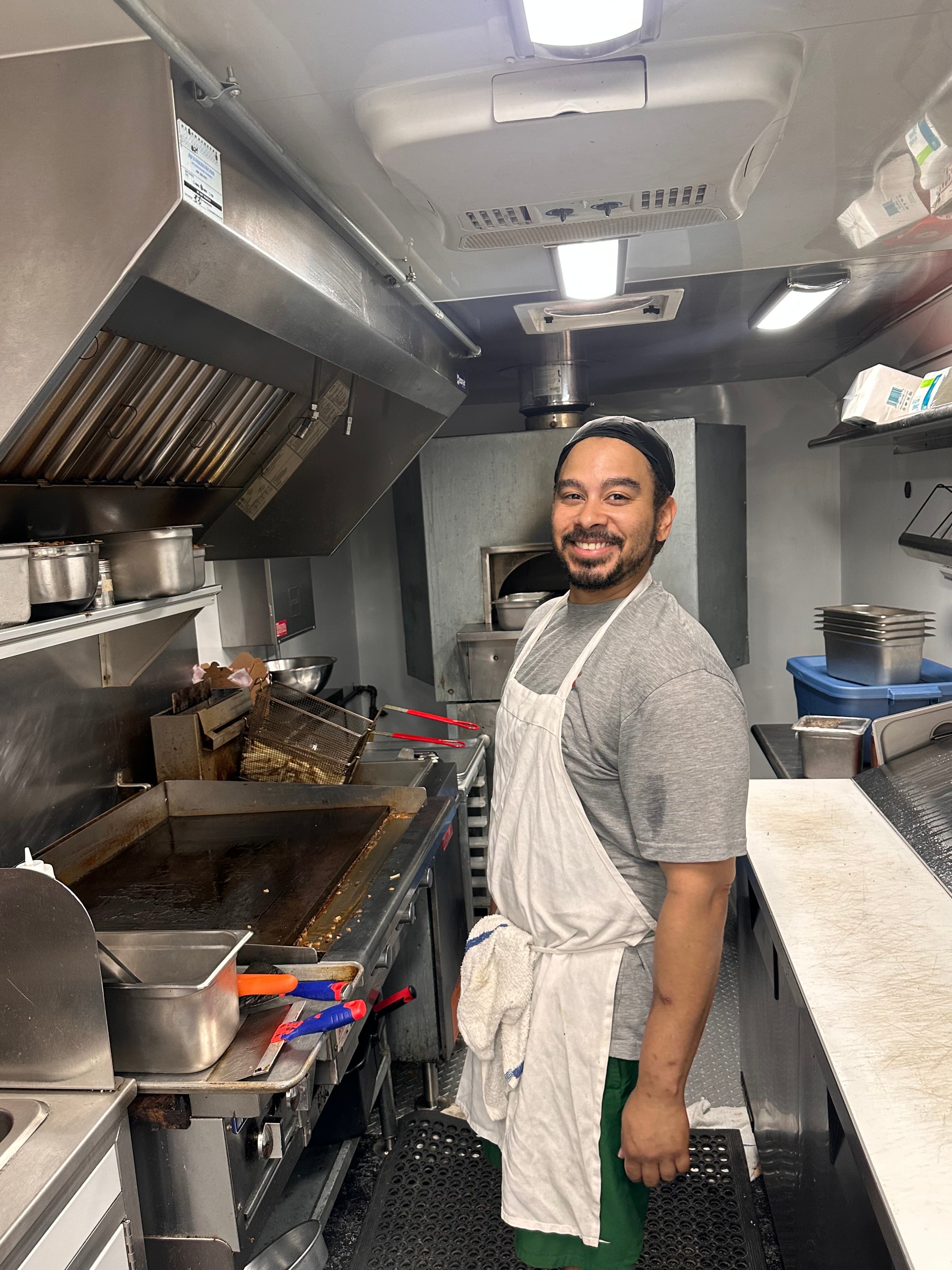 Hoelen Lewis working in the Mangia Mobile food truck